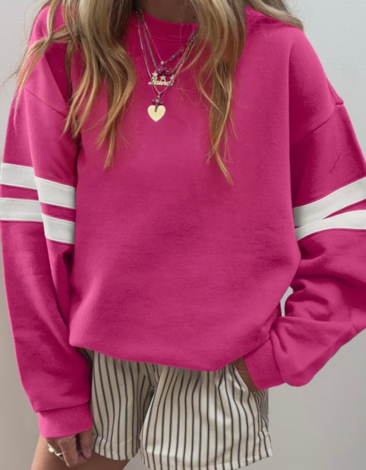 Pink varsity striped sweatshirt